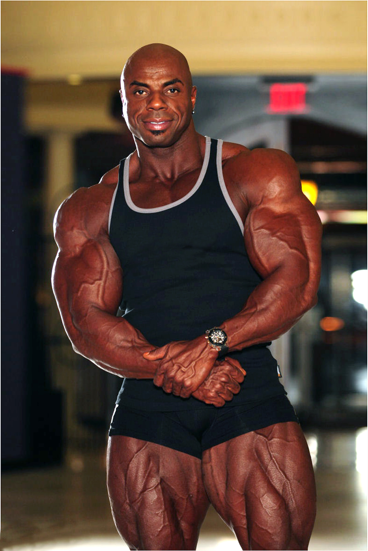 Toney Freeman in a black tank top showing arm and leg development